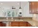 Stylish kitchen with granite counters, stainless steel appliances, and a view of the living area at 1607 Folly Creek Way Way # C-5, Charleston, SC 29412