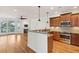 Open kitchen with granite countertops and stainless steel appliances overlooks living room and fireplace at 1607 Folly Creek Way Way # C-5, Charleston, SC 29412