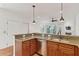 Inviting kitchen featuring granite countertops, stainless steel appliances, and open layout at 1607 Folly Creek Way Way # C-5, Charleston, SC 29412