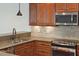 Modern kitchen with stainless steel appliances and granite countertops with tile backsplash at 1607 Folly Creek Way Way # C-5, Charleston, SC 29412
