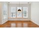 Neutral-toned living area with hardwood floors and natural light coming through windows at 1607 Folly Creek Way Way # C-5, Charleston, SC 29412