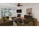 Comfortable living room with a fireplace, hardwood floors, and tastefully furnished at 1607 Folly Creek Way Way # C-5, Charleston, SC 29412
