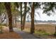 Scenic path lined with palm trees and views of the marsh at 1607 Folly Creek Way Way # C-5, Charleston, SC 29412