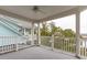Wide porch shows views to the marsh and neighboring homes at 1607 Folly Creek Way Way # C-5, Charleston, SC 29412
