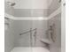 Modern tiled shower with glass doors, shower seat and safety bar at 1607 Folly Creek Way Way # C-5, Charleston, SC 29412