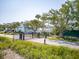Gated entrance to a lovely neighborhood with well-maintained lawns at 1607 Folly Creek Way Way # C-5, Charleston, SC 29412