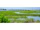 Scenic water view showcasing a bridge and marshland, creating a peaceful coastal ambiance and stunning landscape at 1607 Folly Creek Way Way # C-5, Charleston, SC 29412