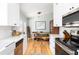 Bright kitchen with an adjacent dining area featuring a live edge wood table and bench at 1649 Lauda Dr, Mount Pleasant, SC 29464