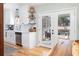 Modern kitchen featuring white cabinets, stainless steel appliances, and a view to the screened porch at 1649 Lauda Dr, Mount Pleasant, SC 29464