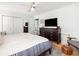 Spacious main bedroom featuring a large bed, hardwood floors, and a dark wood dresser at 1649 Lauda Dr, Mount Pleasant, SC 29464
