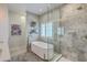 Modern bathroom featuring a freestanding tub, separate shower, and elegant fixtures for a spa-like experience at 1702 Sparkleberry Ln, Johns Island, SC 29455