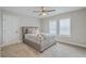 Inviting bedroom featuring plush carpet, a comfortable bed, and natural light at 1702 Sparkleberry Ln, Johns Island, SC 29455