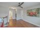 Versatile bonus room boasting hardwood floors, ceiling fan, and decorative car print at 1702 Sparkleberry Ln, Johns Island, SC 29455