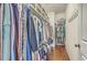 Well-organized closet with ample hanging space, shelving, and storage for clothing and accessories at 1702 Sparkleberry Ln, Johns Island, SC 29455