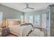 Relaxing bedroom space featuring a ceiling fan, ample natural light, and closet with plenty of storage at 1702 Sparkleberry Ln, Johns Island, SC 29455