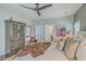 Comfortable main bedroom featuring stylish furniture, soft lighting, and an ensuite bathroom for added convenience at 1702 Sparkleberry Ln, Johns Island, SC 29455