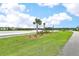 Lakeside neighborhood featuring a pond with beautiful landscaping at 1702 Sparkleberry Ln, Johns Island, SC 29455