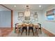 Bright dining room features hardwood floors, a stylish light fixture, and decorative wall art at 1706 W Avalon Cir, Charleston, SC 29407