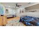 Finished bedroom features hardwood floors, a ceiling fan, a loveseat, and a window with plantation shutters at 1886 Omni Blvd, Mount Pleasant, SC 29466