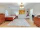 Bedroom featuring hardwood floors, lots of furniture, a ceiling fan, and a window with plantation shutters at 1886 Omni Blvd, Mount Pleasant, SC 29466