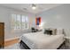 Bedroom featuring a bed with white linens, side tables, a ceiling fan, and a window with shutters at 1886 Omni Blvd, Mount Pleasant, SC 29466