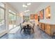 Open dining area features modern lighting and a large sliding glass door at 1886 Omni Blvd, Mount Pleasant, SC 29466