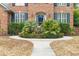 Close-up of front entrance highlighting manicured greenery and detailed brickwork at 1886 Omni Blvd, Mount Pleasant, SC 29466