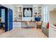Bright home office with custom built-ins, hardwood floors, and a cozy seating area. Perfect for working at 1886 Omni Blvd, Mount Pleasant, SC 29466
