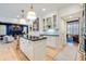 Stylish kitchen with stainless steel appliances, large island with seating, and seamless access to living room at 1886 Omni Blvd, Mount Pleasant, SC 29466