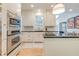 Bright kitchen boasts stainless appliances, white cabinetry, and black countertops at 1886 Omni Blvd, Mount Pleasant, SC 29466