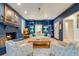 Elegant living room featuring a brick fireplace, custom built-ins, and an open layout, perfect for entertaining at 1886 Omni Blvd, Mount Pleasant, SC 29466