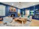 Stylish living room showcasing a cozy fireplace, built-in shelving, a modern ceiling fan and ample natural light at 1886 Omni Blvd, Mount Pleasant, SC 29466