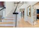 Bright foyer with a wood staircase and hardwood flooring at 1886 Omni Blvd, Mount Pleasant, SC 29466