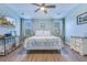 Spacious bedroom with decorative accents and ample natural light, complete with TV and dressers at 196 Fair Sailing Rd # 25, Mount Pleasant, SC 29466