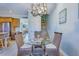 Open dining area with glass table and wicker chairs, with stairs and kitchen views at 196 Fair Sailing Rd # 25, Mount Pleasant, SC 29466