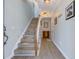 Welcoming hallway featuring wood floors, staircase with lighting, and decorative wall art at 196 Fair Sailing Rd # 25, Mount Pleasant, SC 29466