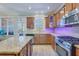 Well-equipped kitchen boasts stainless steel appliances, granite counters and center island, and tile backsplash at 196 Fair Sailing Rd # 25, Mount Pleasant, SC 29466