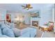 Open living room layout with a fireplace, ample seating, and a ceiling fan at 196 Fair Sailing Rd # 25, Mount Pleasant, SC 29466