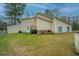 Expansive backyard featuring a well-maintained lawn, patio, and convenient access from the house at 2015 Albert Storm Ave, Moncks Corner, SC 29461