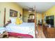 Cheerful bedroom with hardwood floors, comfortable four-poster bed, and warm lighting at 2015 Albert Storm Ave, Moncks Corner, SC 29461