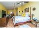 Bright bedroom with wood-look flooring, four-poster bed, and natural light at 2015 Albert Storm Ave, Moncks Corner, SC 29461