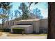 View of tan home and manicured lawn and shrubs at 2015 Albert Storm Ave, Moncks Corner, SC 29461