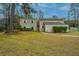 Two-story home with mature trees, manicured lawn and siding exterior at 2015 Albert Storm Ave, Moncks Corner, SC 29461