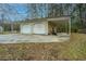 Detached two-car garage with covered carport, offering convenient parking and additional storage at 2015 Albert Storm Ave, Moncks Corner, SC 29461