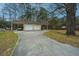 Two-car garage and carport offering plenty of parking and storage, complemented by a long, paved driveway at 2015 Albert Storm Ave, Moncks Corner, SC 29461
