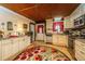 Charming kitchen with wooden ceiling, countertops, stainless appliances, and patterned rug at 2015 Albert Storm Ave, Moncks Corner, SC 29461