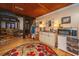 Open-concept living space with hardwood floors, dining area, and wood-paneled ceiling at 2015 Albert Storm Ave, Moncks Corner, SC 29461