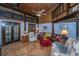 Bright living room with parquet floors, wood-paneled ceiling, and comfortable leather furniture at 2015 Albert Storm Ave, Moncks Corner, SC 29461
