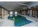 Indoor pool in a spacious building, surrounded by large windows, lounge chairs, and multiple entry/exit points at 2015 Albert Storm Ave, Moncks Corner, SC 29461