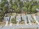 An aerial shot displays backyard pools and fences amongst lush trees, complemented by neighborhood street views at 2025 Lanneau Ln, Johns Island, SC 29455